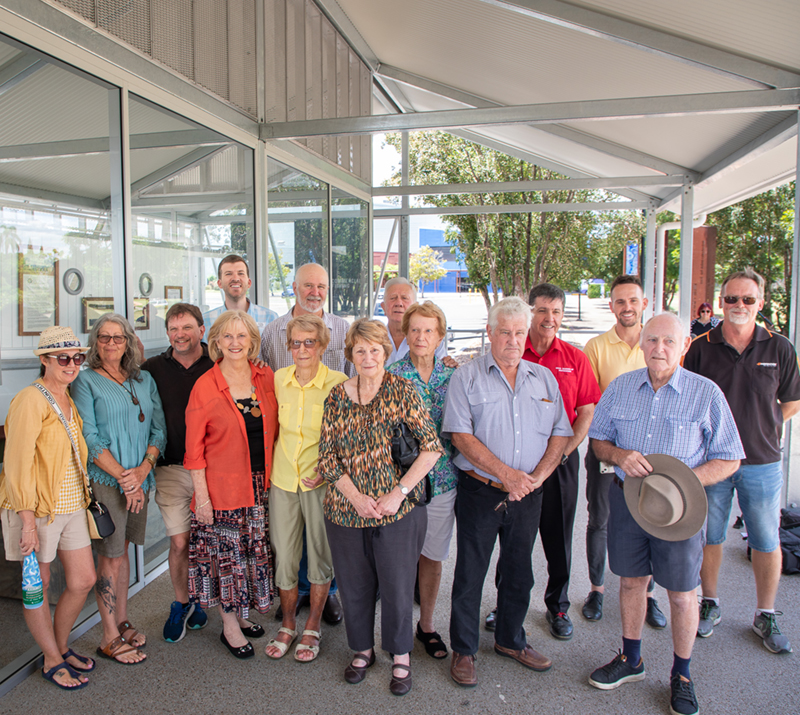 Deputy Mayor Paul Truscott and Member for Maryborough Bruce Saunders with family including grandchildren and great grandchildren of the original builder Henry Hume along side other community members who have worked restoring the boat.